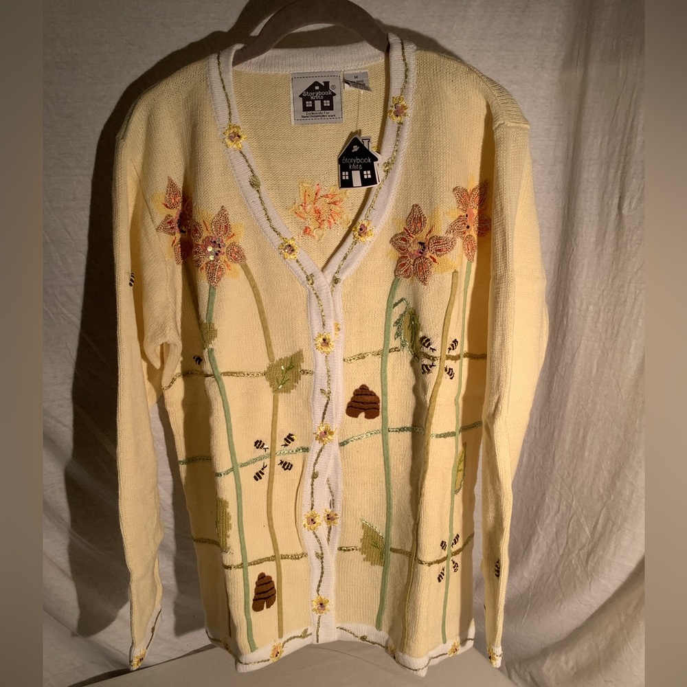 Storybook knit sweater titled “Buzzin for Sun”